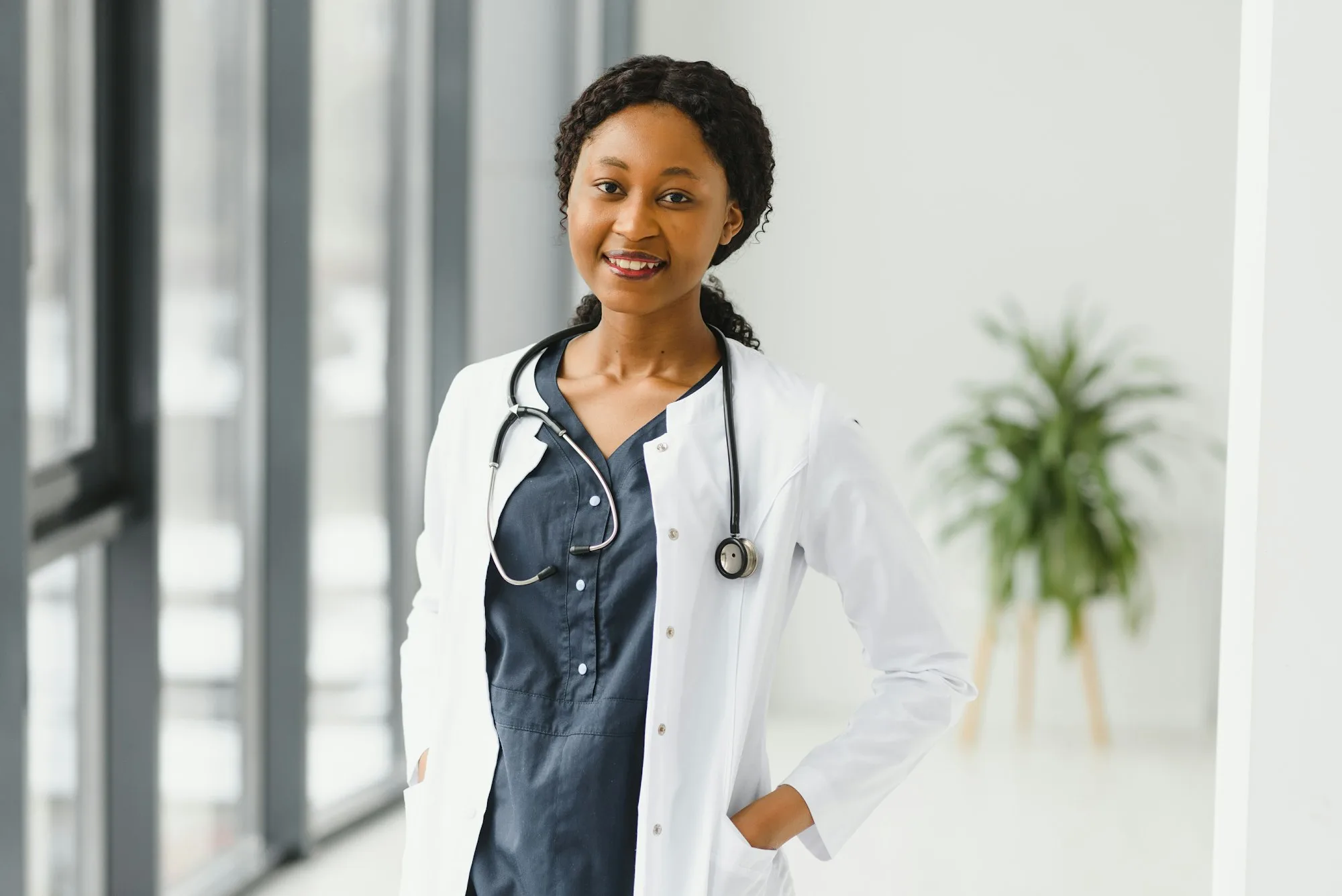 portrait of african female doctor at workplace.